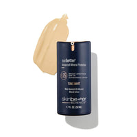 Sunbetter sunscreen lotion bottle with a smear of sunscreen on a white background