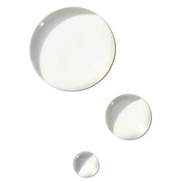 Three clear serum drops in different sizes arranged diagonally on a solid white background.