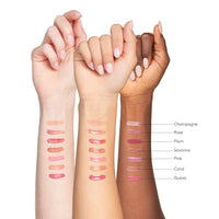 Three hands with different skin tones displaying various lip color swatches on a white background.
