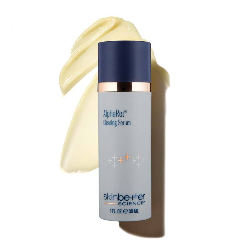 AlphaRet clearing serum bottle with a swatch of cream on a white background