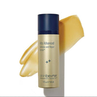 Skincare serum bottle with gold color swatch on a white background