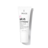 A white squeeze tube of Image Skincare Ormedic Sheer Pink Lip Enhancement Complex, featuring black text and a small pink lips graphic, set against a clean white background with a soft shadow.