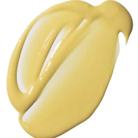 A thick, glossy swatch of pale yellow cream on a plain white background.