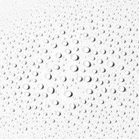 Textured white surface with spray circular liquid droplets