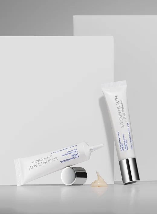 Two skincare products on a light gray background