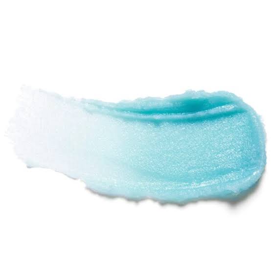A textured swipe of icy light blue polish on a solid white background.