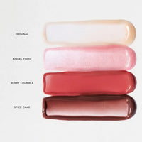 Four lip gloss shades labeled 'Original', 'Angel Food', 'Berry Crumble', and 'Spice Cake' on a white background.